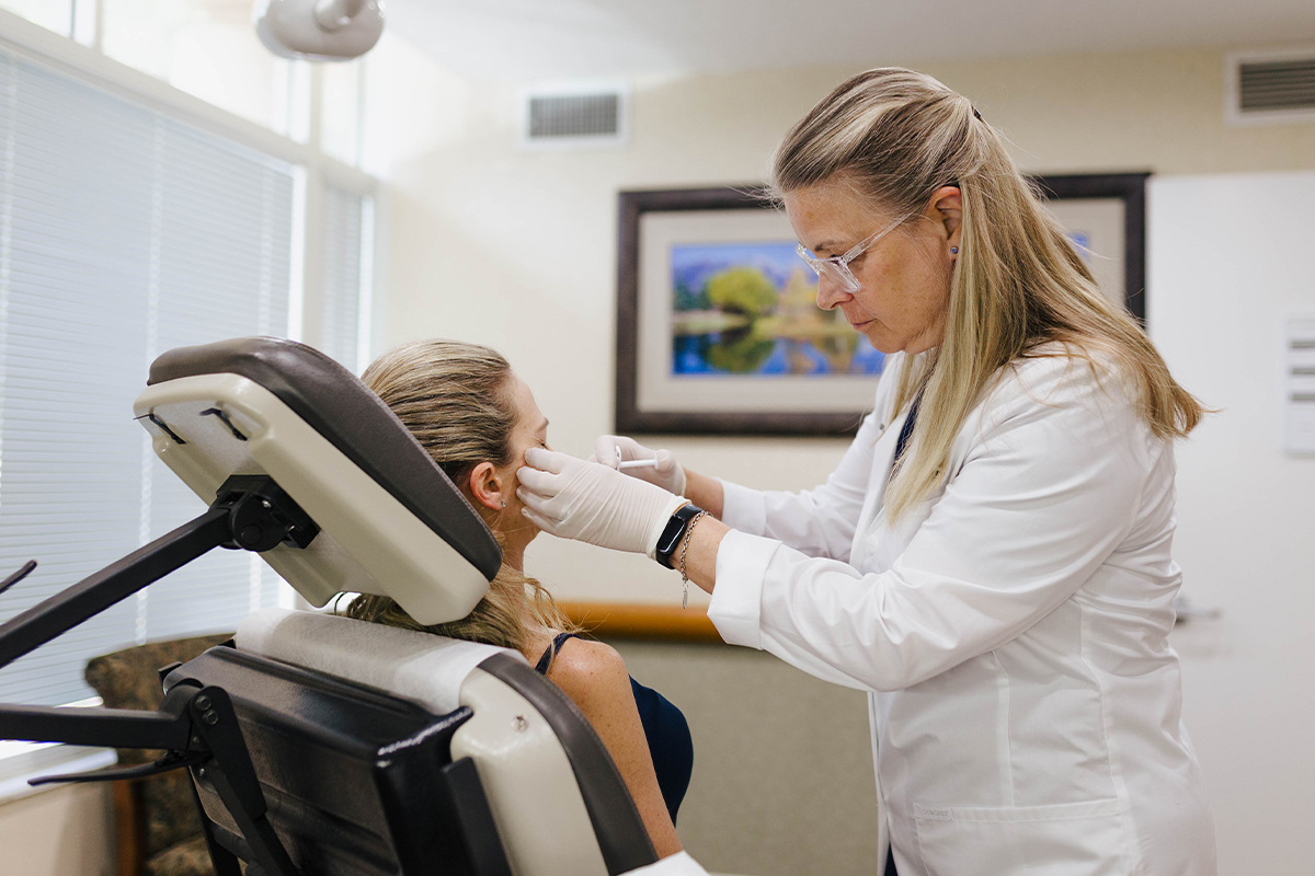a dermatologist giving a patient restylane in sarasota
