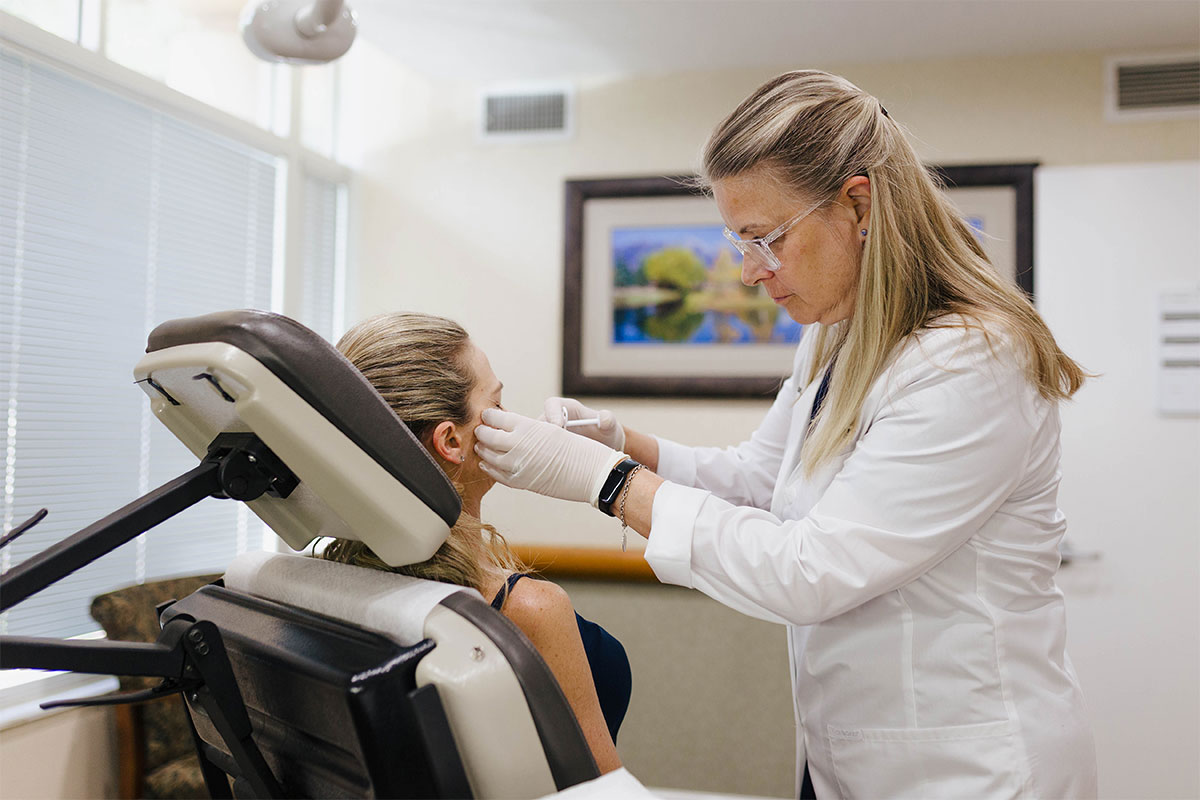 a woman getting dermal cosmetic fillers in Sarasota